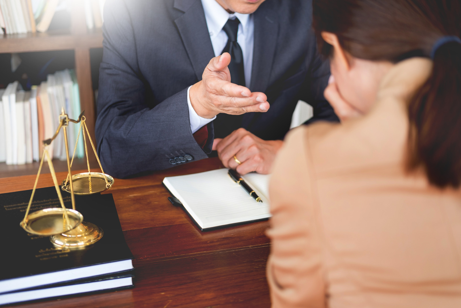 A lawyer engaged in a discussion with a distressed client