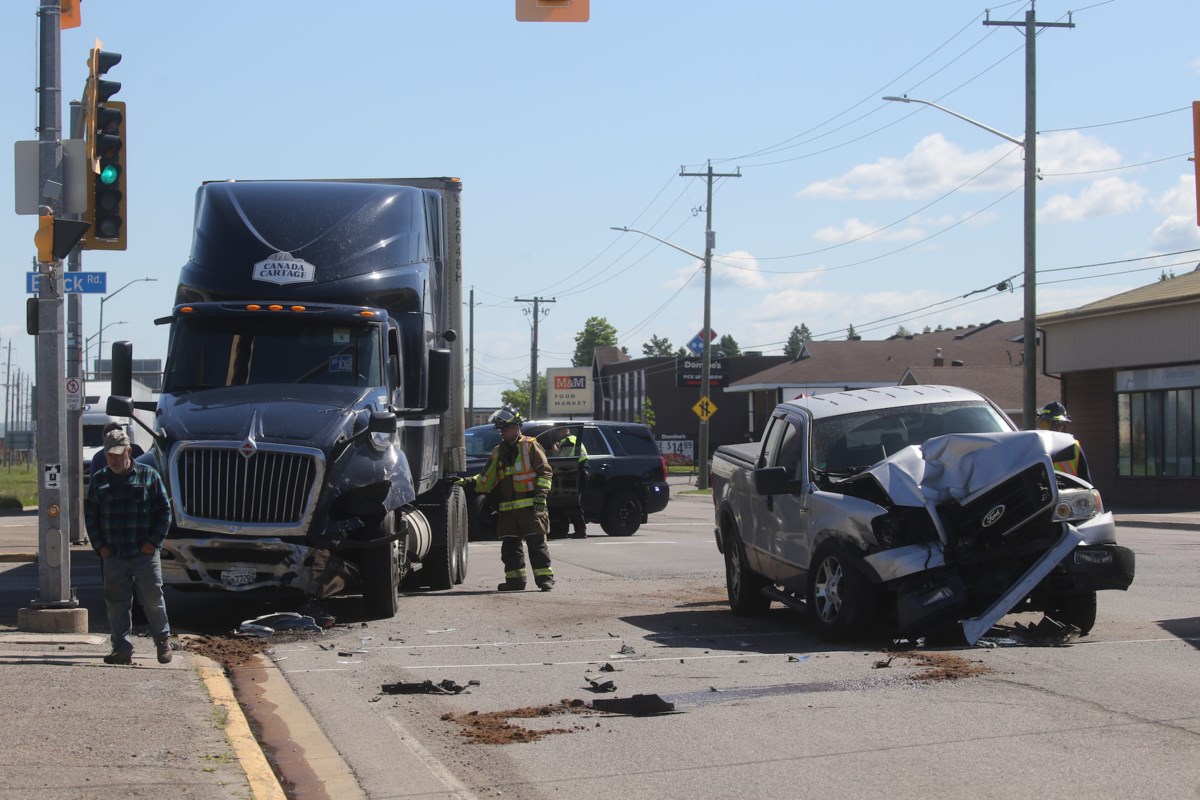 Semi truck crash with white pickup