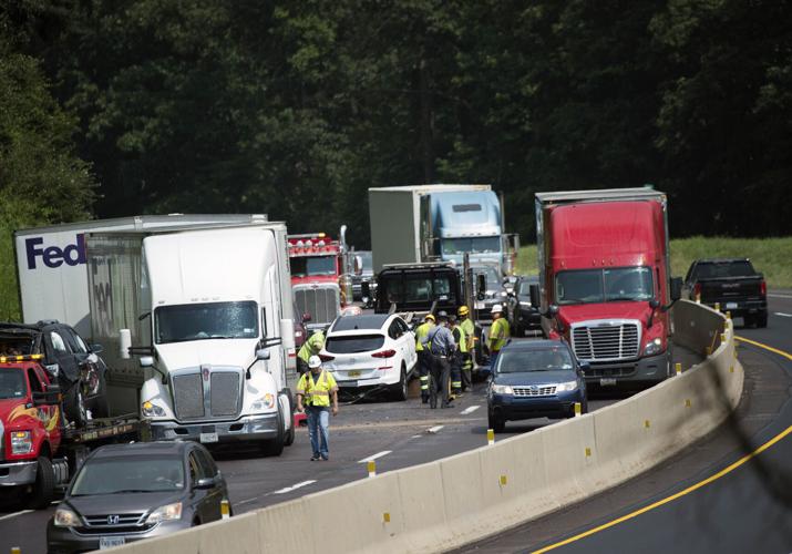 Crash involving several semi trucks and cars on a highway