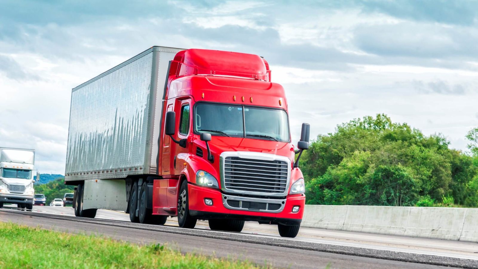 Red semi truck on a highway