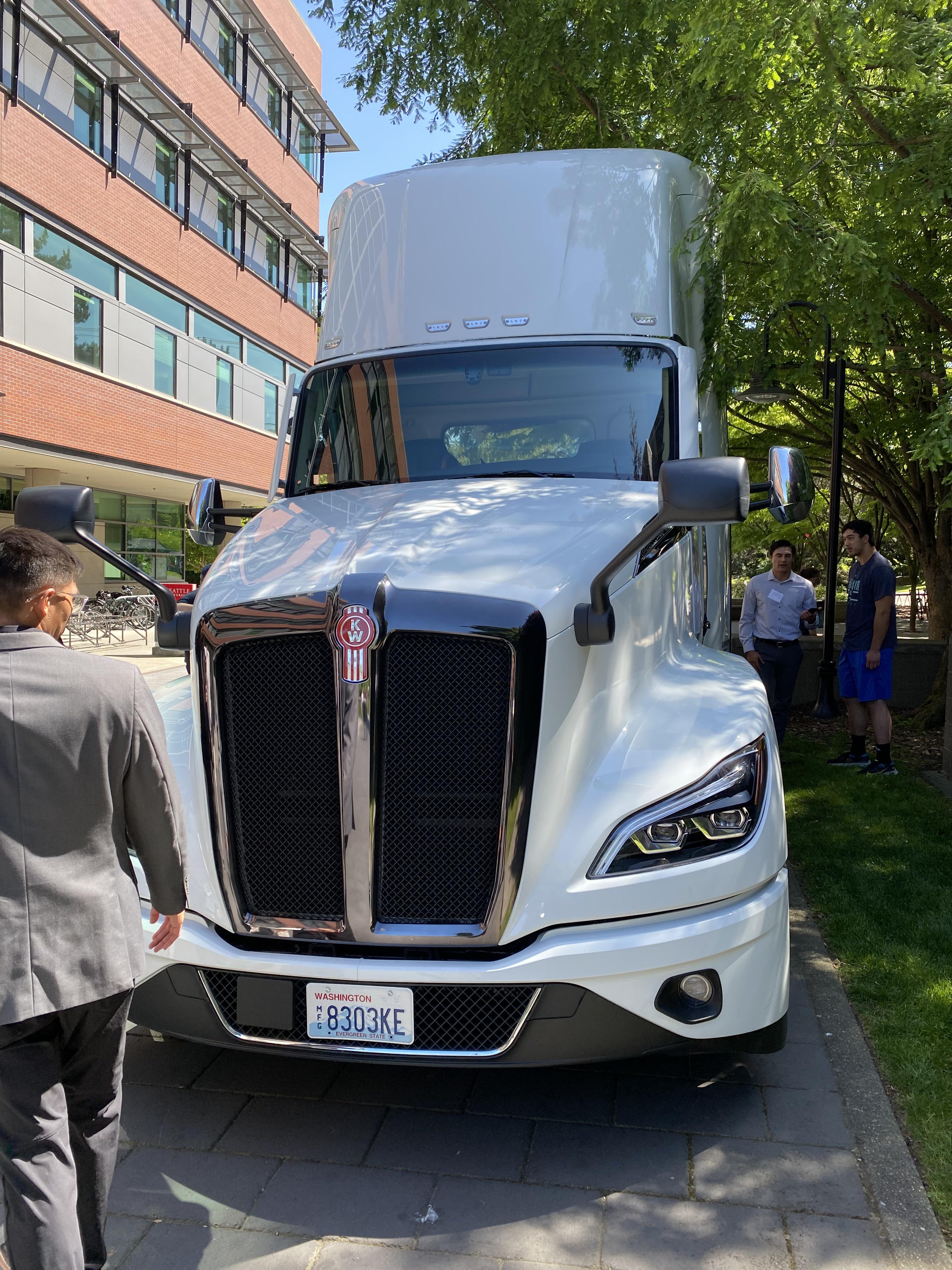 White semi truck parked on a street