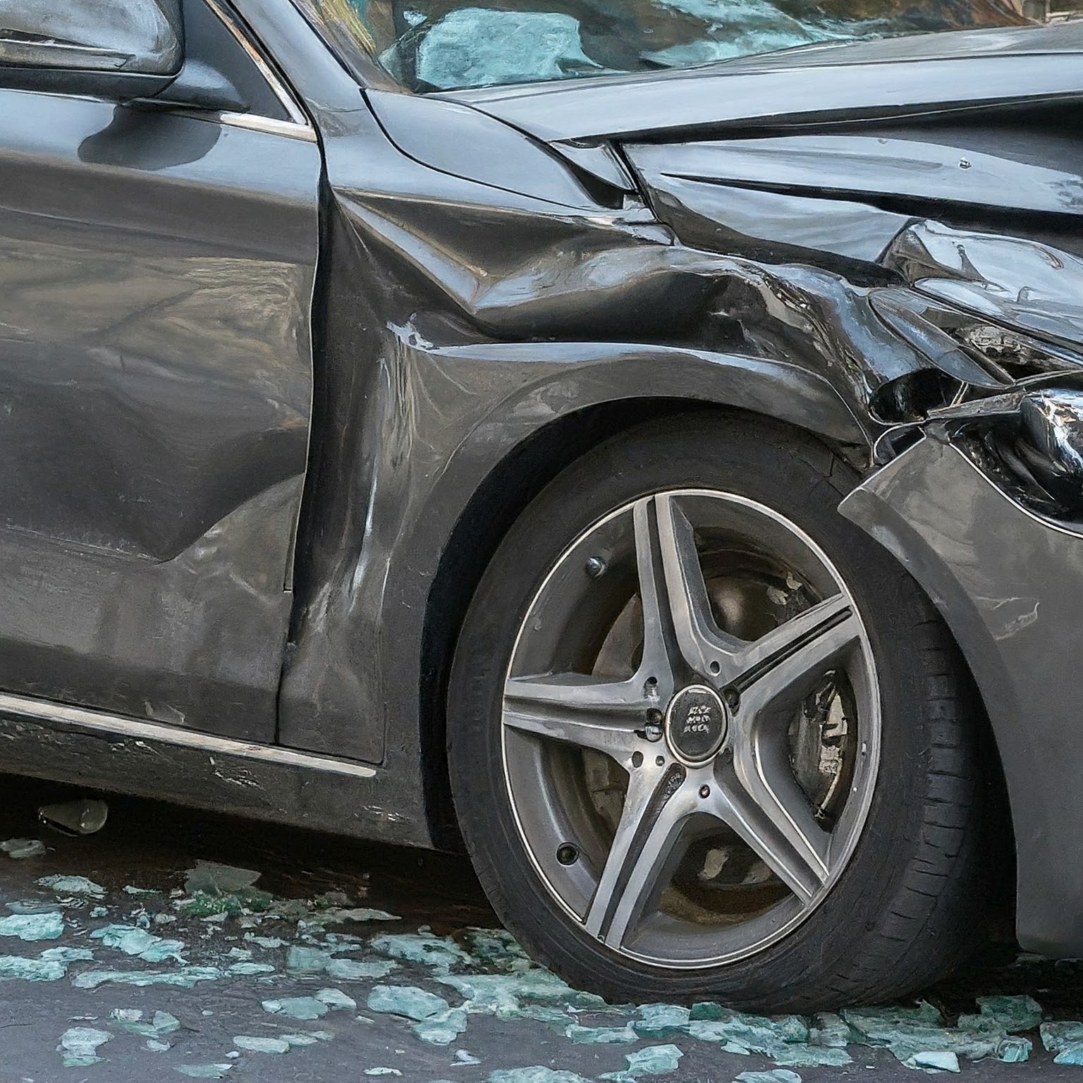 Gray car with crash damage 