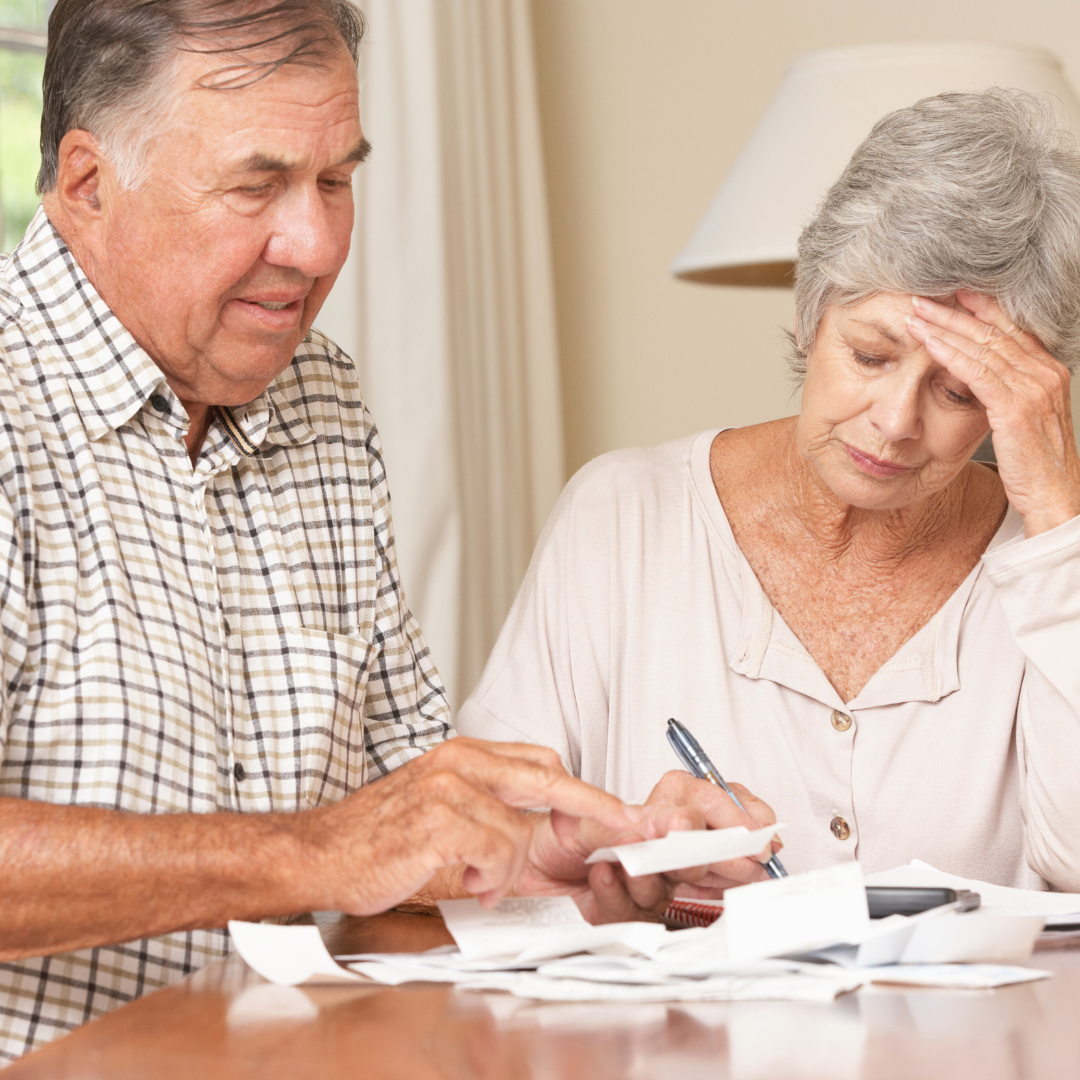 Elderly Couple Looking at Bills