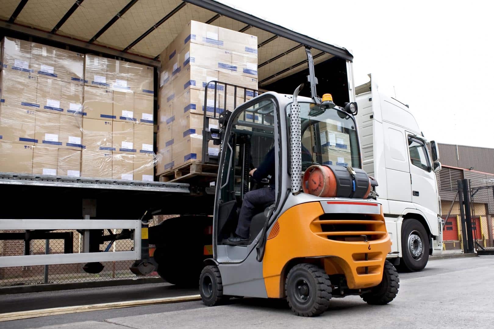 Cargo being loaded onto a truck trailer