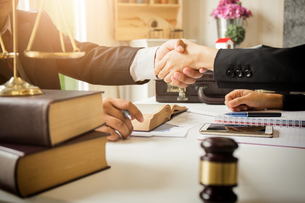 Lawyer and client shaking hands