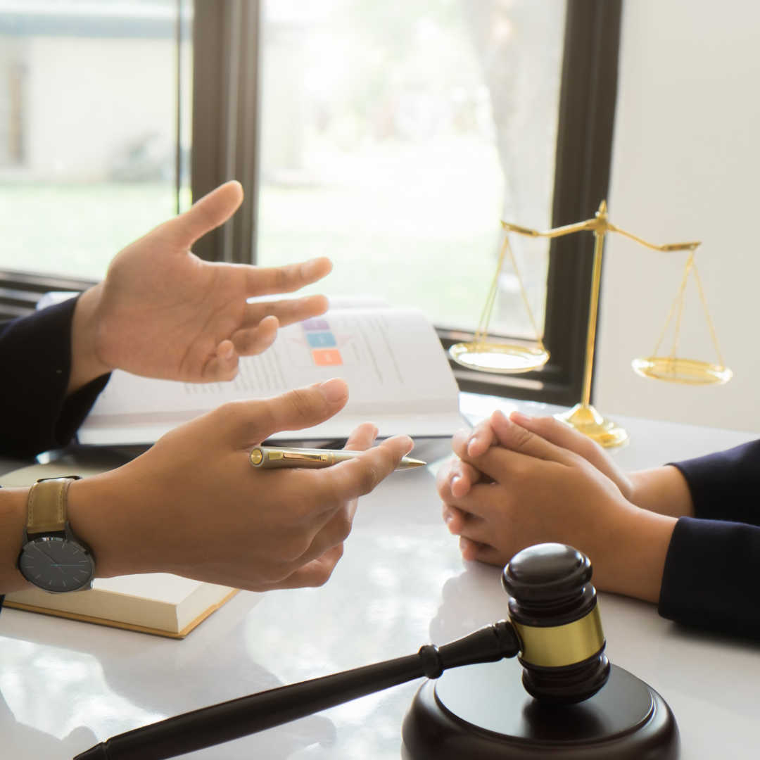 Attorney and client at a desk