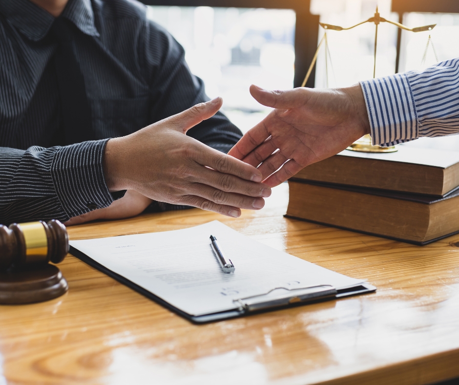 Lawyer shaking hands with a man