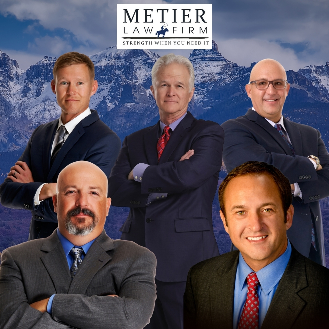 A group of Metier Law Firm lawyers in front of the Rocky Mountains