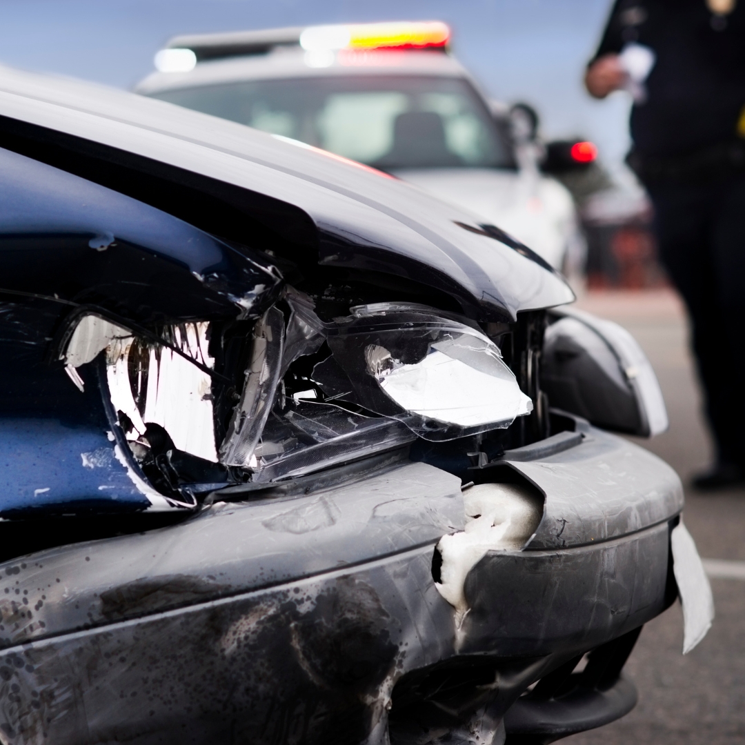 Car crash with police officer in the background