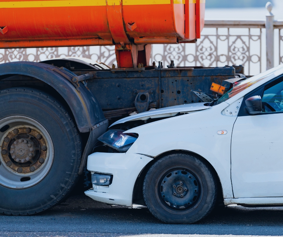 White car crashed into tanker truck