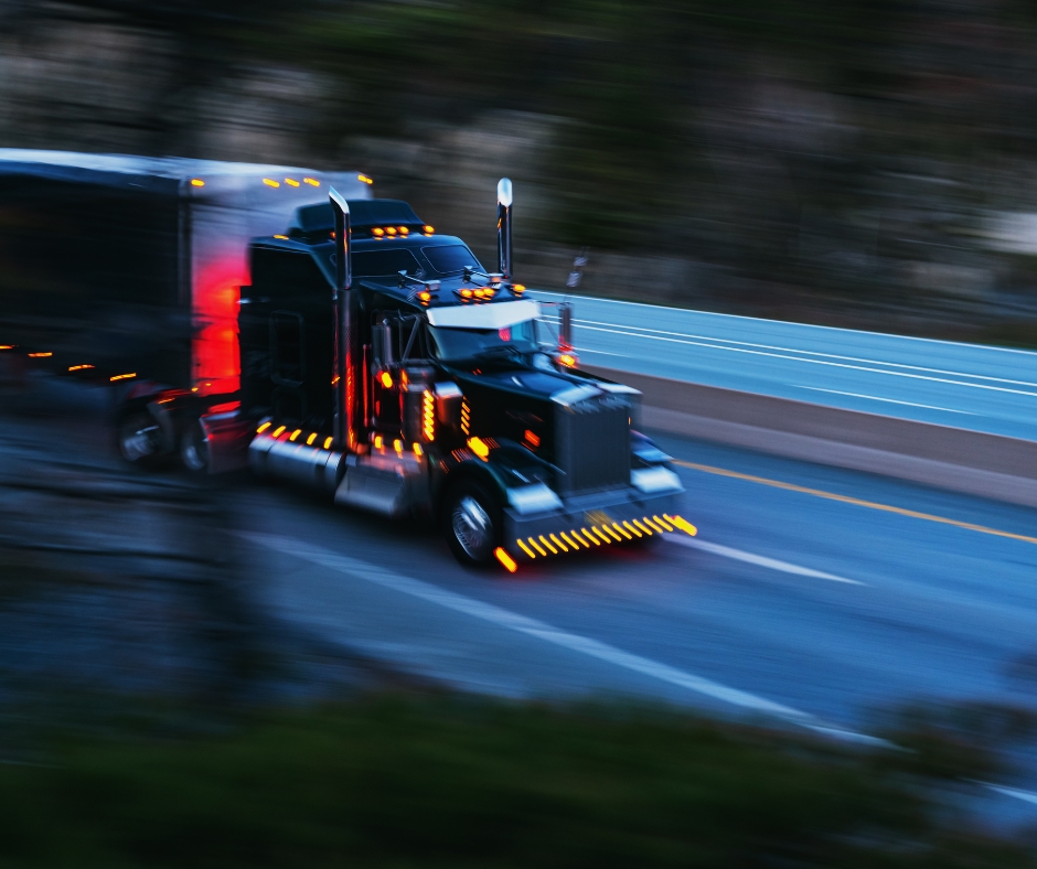 Semi truck going down a highway