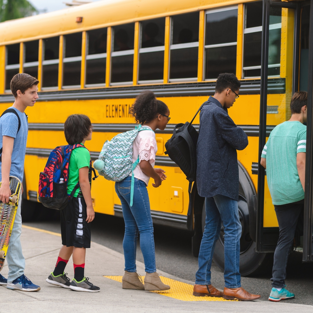 Children in line to board a school bus