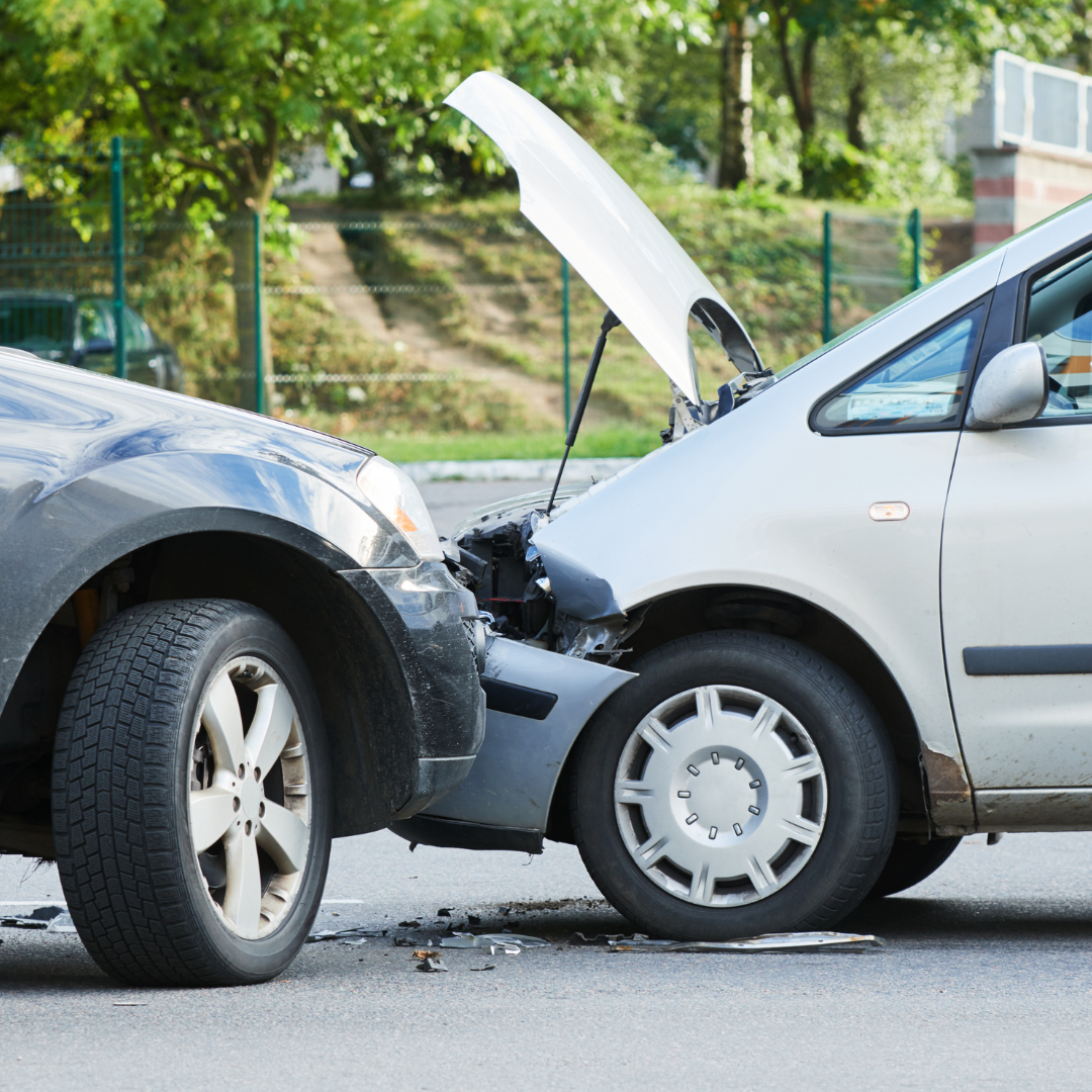 two cars in a front collision