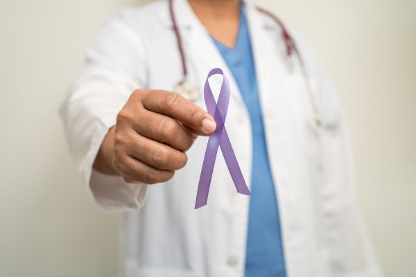 Esophageal Awareness Month purple ribbon held by a doctor