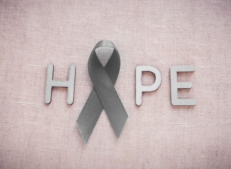 The word hope and a gray ribbon for Brain Cancer Awareness Month.